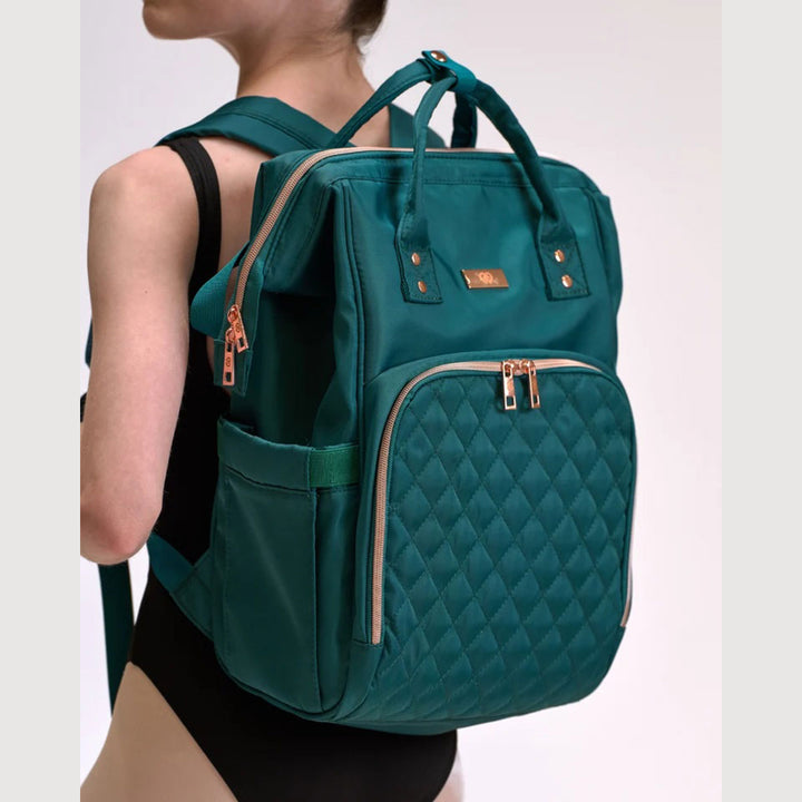 Dancer wearing the Claudia Dean Pro Bag 2.0 backpack in Royal Green