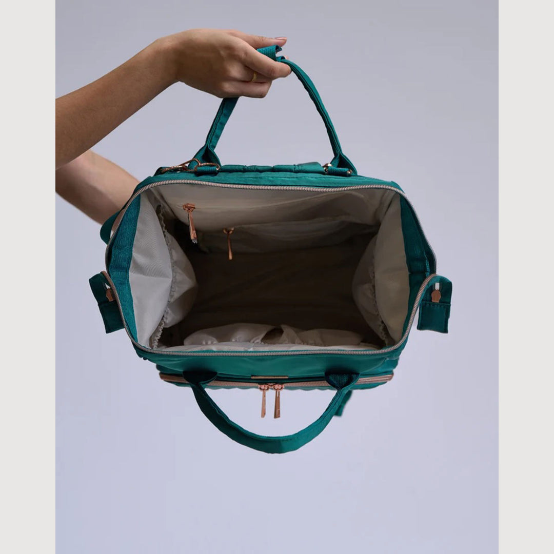 Claudia Dean Pro Bag 2.0 backpack in Royal Green open to show the baby pink lining